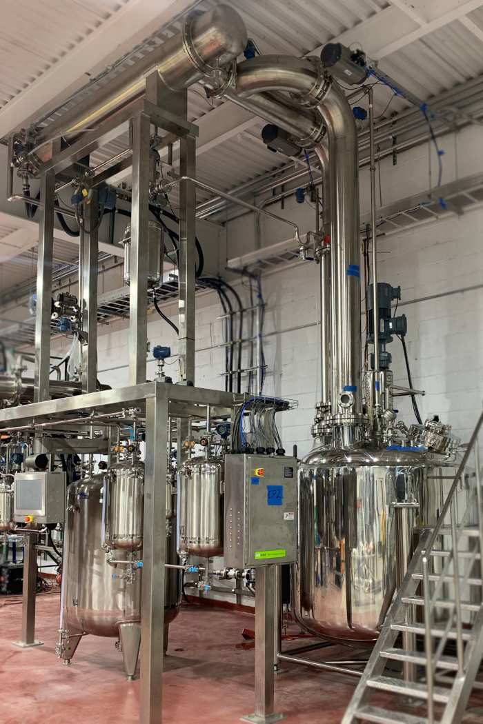 Mk 5 vacuum distillation system built in stainless steel with copper structured packing internals developed to produce vacuum distilled beer whiskey designed and engineered by The Engine Room